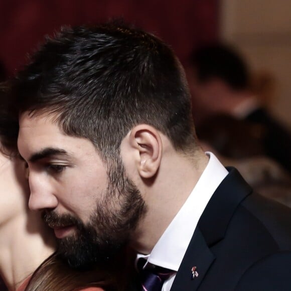 Nikola Karabatic et sa compagne Géraldine Pillet lors de la réception de l'équipe des France de Handball, championne du monde, au palais de l'Elysée à Paris, le 30 janvier 2017, au lendemain de sa victoire en finale de la coupe du monde contre l'équipe de la Norvège.