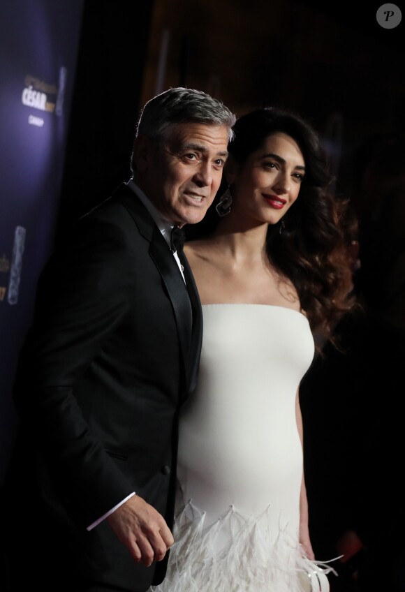 George Clooney et sa femme Amal Alamuddin-Clooney, enceinte - Photocall de la 42e cérémonie des Cesar à la salle Pleyel à Paris, le 24 février 2017. © Dominique Jacovides - Olivier Borde / Bestimage