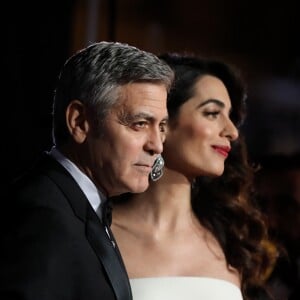 George Clooney (montre Omega) et sa femme Amal Alamuddin-Clooney (enceinte) - Photocall de la 42e cérémonie des Cesar à la salle Pleyel à Paris, le 24 février 2017. © Dominique Jacovides - Olivier Borde / Bestimage