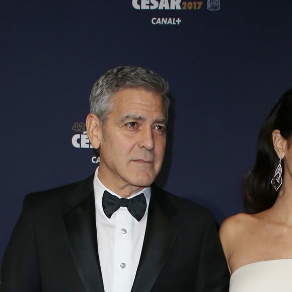 George Clooney (montre Omega) et sa femme Amal Alamuddin-Clooney (enceinte) arrivant à la 42e cérémonie des César à la Salle Pleyel à Paris le 24 février 2017. © Olivier Borde / Dominique Jacovides / Bestimage