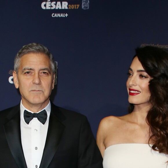 George Clooney (montre Omega) et sa femme Amal Alamuddin-Clooney (enceinte) arrivant à la 42e cérémonie des César à la Salle Pleyel à Paris le 24 février 2017. © Olivier Borde / Dominique Jacovides / Bestimage