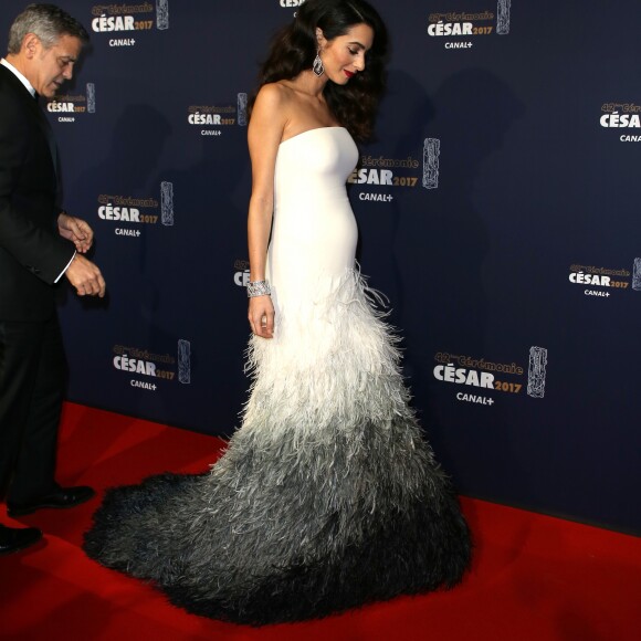 George Clooney (montre Omega) et sa femme Amal Alamuddin-Clooney (enceinte) arrivant à la 42e cérémonie des César à la Salle Pleyel à Paris le 24 février 2017. © Olivier Borde / Dominique Jacovides / Bestimage