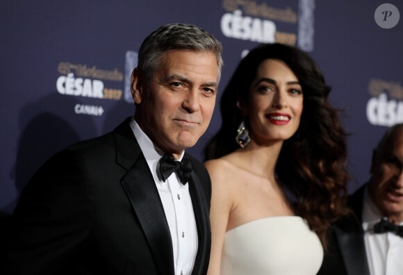 George Clooney et sa femme Amal Clooney (enceinte) - Photocall de la 42ème cérémonie des Cesar à la salle Pleyel à Paris, le 24 février 2017. © Dominique Jacovides - Olivier Borde / Bestimage