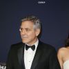 George Clooney (montre Omega) et sa femme Amal Clooney (enceinte) arrivant à la 42ème cérémonie des César à la Salle Pleyel à Paris le 24 février 2017. © Olivier Borde / Dominique Jacovides / Bestimage