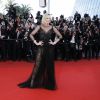 Charlize Theron (en robe Christian Dior et bijoux Chopard) - Montée des marches de la Soirée du 70ème Anniversaire du Festival de Cannes. Le 23 mai 2017