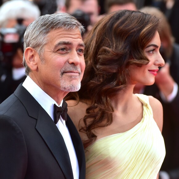 George Clooney et sa femme Amal Alamuddin Clooney (bijoux Cartier) - Montée des marches du film "Money Monster" lors du 69e Festival International du Film de Cannes. Le 12 mai 2016. © Giancarlo Gorassini/Bestimage