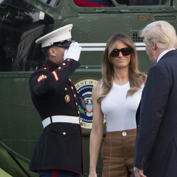 Le président des États-Unis Donald J. Trump, son épouse Melania Trump et leur fils Barron Trump rentrent à la Maison-Blanche. Washington, le 11 juin 2017.