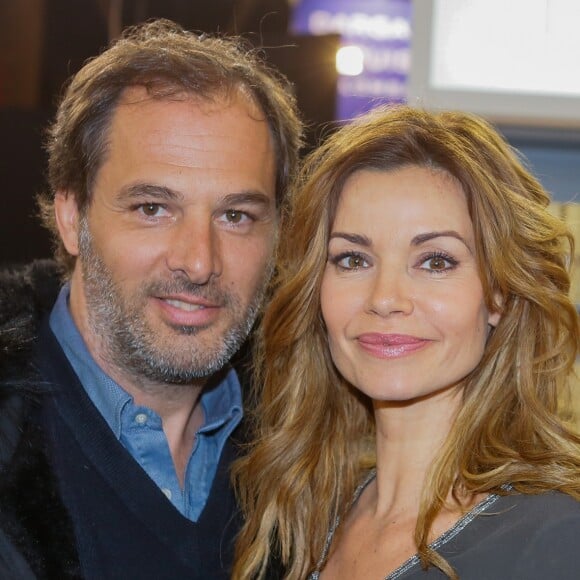 Ingrid Chauvin et son mari Thierry Peythieu au salon du livre à la porte de Versailles à Paris le 22 mars 2015.