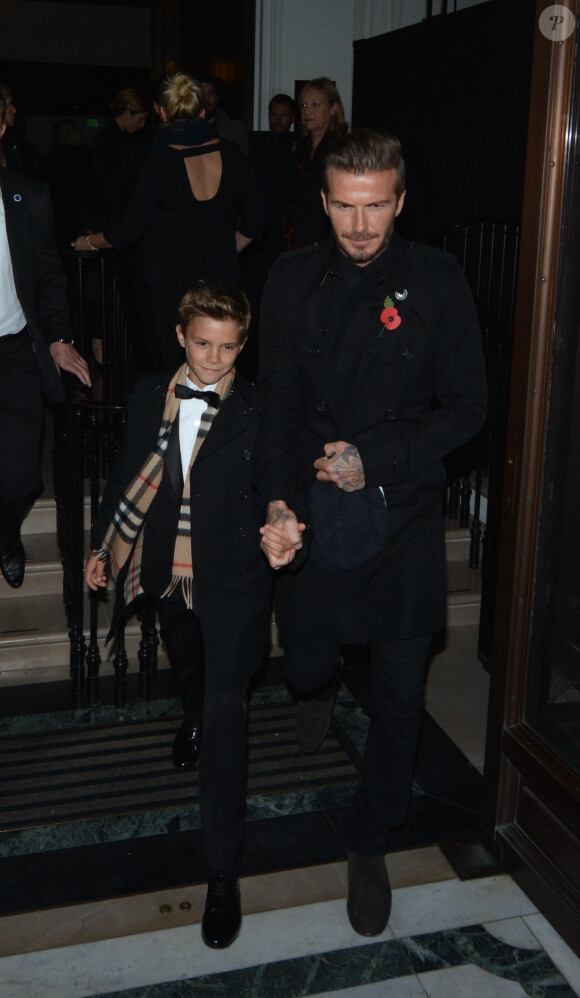 David Beckham et son fils Romeo à l'issue d'une soirée Burberry à Londres, le 3 novembre 2014.
