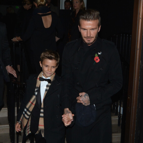David Beckham et son fils Romeo à l'issue d'une soirée Burberry à Londres, le 3 novembre 2014.