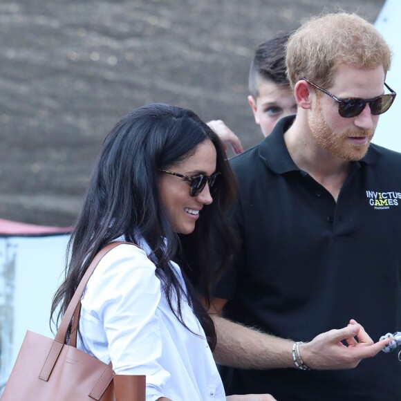 Première apparition officielle du prince Harry et sa compagne Meghan Markle dans les tribunes de la finale de tennis à la troisième édition des Invictus Games à Toronto, le 25 septembre 2017.
