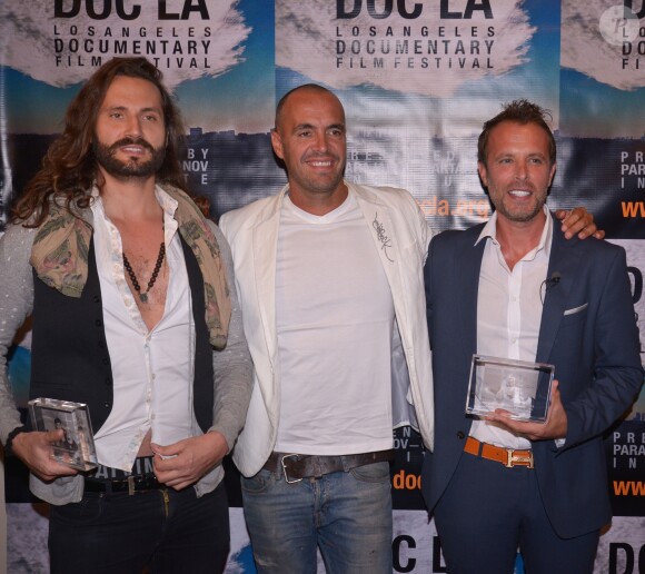 Le réalisateur Didier Beringuer et le producteur Fabrice Sopoglian et guest - Fabrice Sopoglian reçoit deux Awards pour le documentaire "VIF" sur la vie de Christian Audigier lors du festival DOC LA à Los Angeles le 20 octobre 2017.