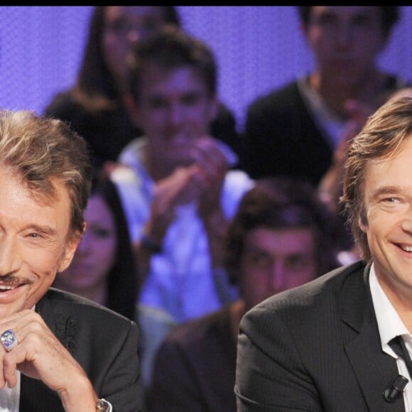 Johnny et David Hallyday sur le plateau du Grand Journal en 2008