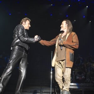 Exclusif - Florent Pagny et Johnny Hallyday en duo lors du "Born Rocker Tour" à l'AccorHotels Arena (ex-Bercy) à Paris, le 14 juin 2013.