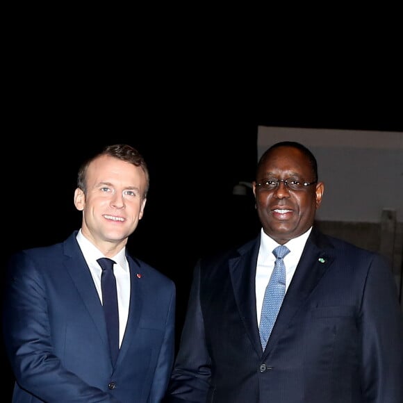 Le président de la République Emmanuel Macron et son homologue le président sénégalais Macky Sall - Le président de la République française et sa femme la Première Dame sont accueillis par le président sénégalais et sa femme la Première Dame à l'aéroport international Léopold-Sédar-Senghor à Dakar, Sénégal, le 1er février 2018. © Dominique Jacovides/Bestimage  French President and his wife are welcomed by Senegalese President and his wife, Marieme Faye Sall at Leopold-Sedar-Senghor airport in Dakar, Senegal on February 2, 2018.01/02/2018 - Dakar