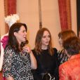 La duchesse Catherine de Cambridge, enceinte et en Erdem, a pu s'entretenir avec Stella McCartney et Anna Wintour lors de la réception organisée pour célébrer le "Commonwealth Fashion Exchange" au Palais de Buckingham à Londres, le 19 février 2018.