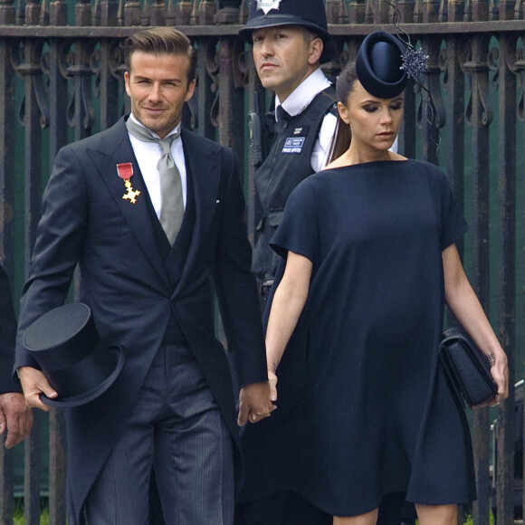 David et Victoria Beckham, enceinte de leur 4e enfant (une fille qu'ils prénommeront Harper) assitent au mariage du prince William et de Kate Middleton à l'abbaye de Westminster. Londres, le 29 avril 2011.