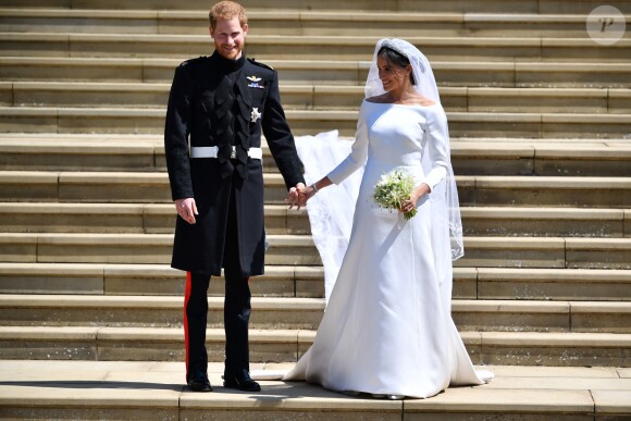 La duchesse Meghan de Sussex (Meghan Markle) dans sa robe Givenchy, dessinée par Clare Waight Keller, lors de son mariage avec le prince Harry le 19 mai 2018 à Windsor.