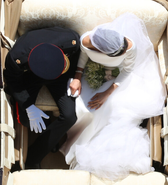 La duchesse Meghan de Sussex (Meghan Markle) dans sa robe Givenchy, dessinée par Clare Waight Keller, lors de son mariage avec le prince Harry le 19 mai 2018 à Windsor.