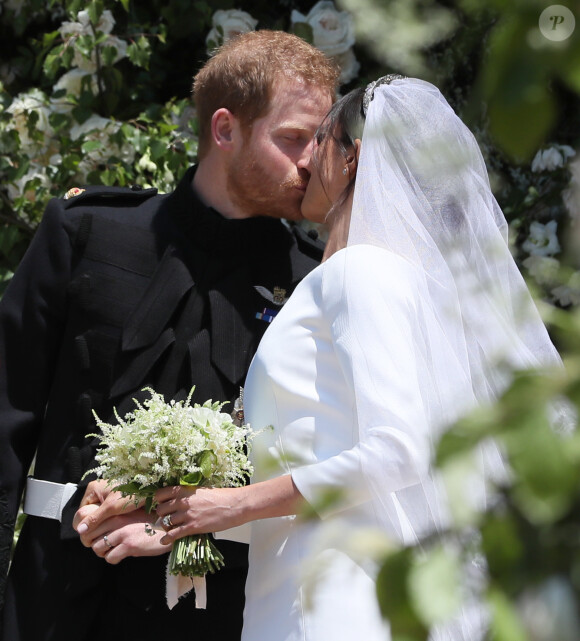 La duchesse Meghan de Sussex (Meghan Markle) dans sa robe Givenchy, dessinée par Clare Waight Keller, lors de son mariage avec le prince Harry le 19 mai 2018 à Windsor.