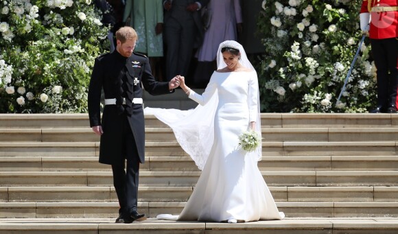 La duchesse Meghan de Sussex (Meghan Markle) dans sa robe Givenchy, dessinée par Clare Waight Keller, lors de son mariage avec le prince Harry le 19 mai 2018 à Windsor.