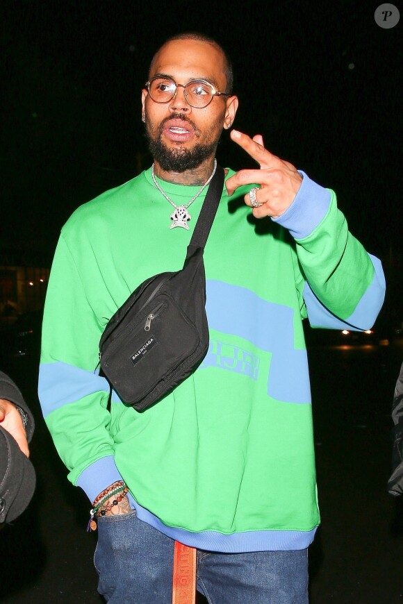 Chris Brown est allé faire la fête avec une jolie inconnue chez Poppy à West Hollywood, le 5 avril 2018