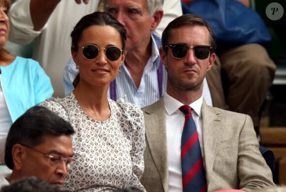 Pippa Middleton, enceinte, et son mari James Matthews au tournoi de Wimbledon à Londres, le 13 juillet 2018.