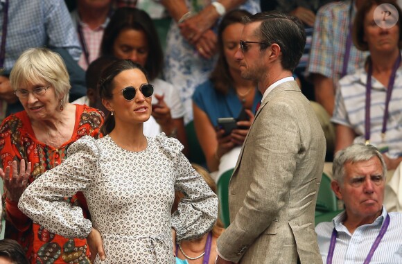 Pippa Middleton, enceinte, et son mari James Matthews au tournoi de Wimbledon à Londres, le 13 juillet 2018.
