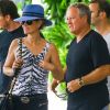 Johnny Hallyday et sa femme Laeticia quittant leur hôtel en compagnie de Sébastien Farran et du père de Laeticia, André Boudou, à Miami, le 12 mai 2014.