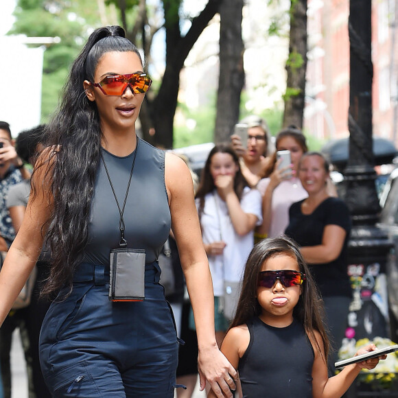Kim Kardashian avec son compagnon Kanye West et leur fille North West se promènent à New York, le 15 juin 2018.