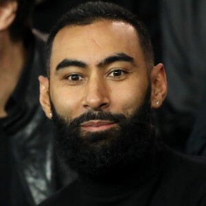 La Fouine dans les tribunes du parc des princes lors du match de football de ligue 1 opposant le Paris Saint-Germain (PSG) à l'Olympique Lyonnais (OL) à Paris, France, le 7 octobre 2018. Le PSG a gagné 5-0.  Celebs in the stands attending the French First League soccer match, Paris Saint-Germain (PSG) vs Olympique Lyonnais (OL) at the Parc des Princes stadium in Paris, France, on October 7, 2018. PSG won 5-0.07/10/2018 - Paris