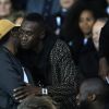 Ahmed Sylla et Blaise Matuidi dans les tribunes du parc des princes lors du match de football de ligue 1 opposant le Paris Saint-Germain (PSG) à l'Olympique Lyonnais (OL) à Paris, France, le 7 octobre 2018.