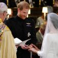  Le prince Harry et Meghan Markle, duc et duchesse de Sussex, échangeant les alliances lors de leur mariage le 19 mai 2018 en la chapelle St George à Windsor. Une cérémonie marquée notamment par leur émouvante complicité amoureuse, qui sautait aux yeux... 
  