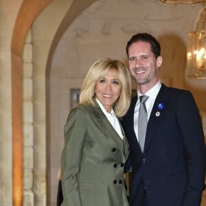 Brigitte Macron et Gauthier Destenay (Mari du premier ministre du Luxembourg) lors du déjeuner des conjoints de chefs d'Etat et de gouvernement présents à la cérémonie internationale du centenaire de l'armistice de 1918 au château de Versailles le 11 novembre 2018. © Pierre Perusseau / Bestimage