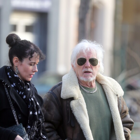 Hugues Aufray et sa compagne Muriel - Après une cérémonie au temple protestant Port-Royal, obsèques de Thierry Séchan au cimetière du Montparnasse à Paris le 16 janvier 2019.
