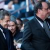 Nicolas Sarkozy et François Hollande lors du match de Ligue 1 entre le Paris Saint-Germain et Nîmes au Parc des Princes le 23 février 2019.