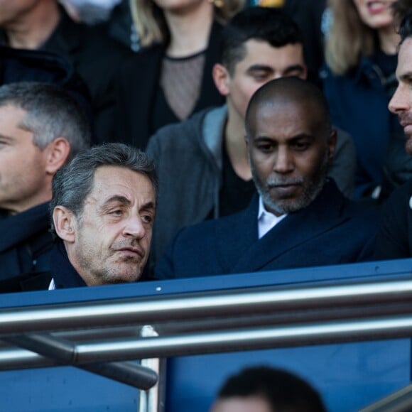 Nicolas Sarkozy et François Hollande lors du match de Ligue 1 entre le Paris Saint-Germain et Nîmes au Parc des Princes le 23 février 2019.