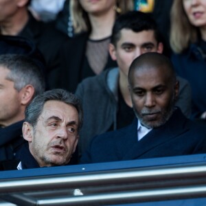 Nicolas Sarkozy et François Hollande lors du match de Ligue 1 entre le Paris Saint-Germain et Nîmes au Parc des Princes le 23 février 2019.