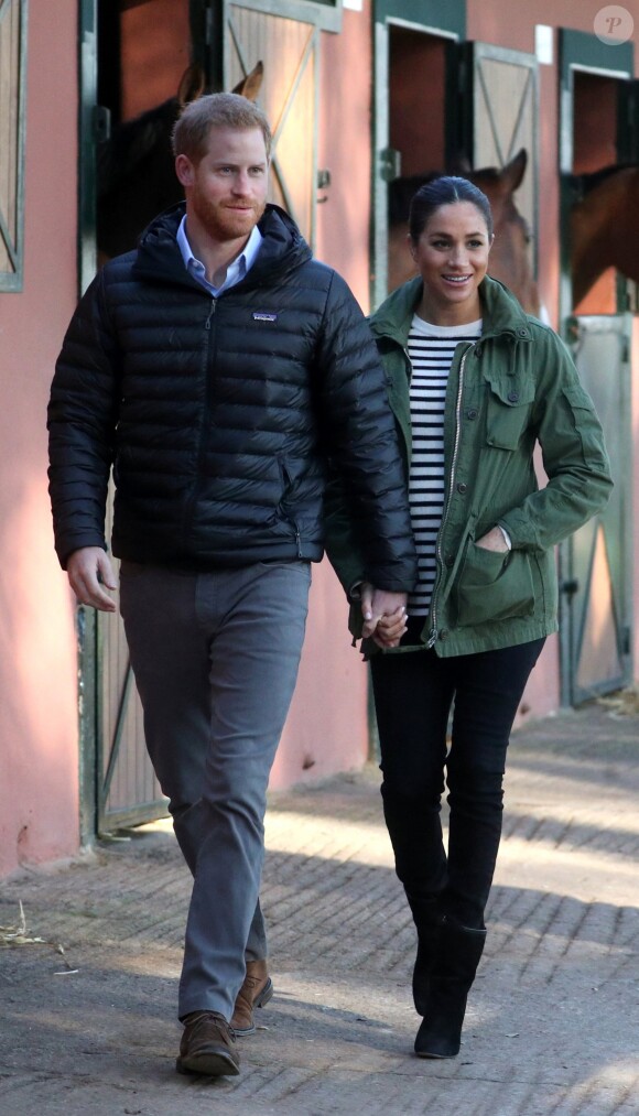 Le prince Harry et Meghan Markle (enceinte), duchesse de Sussex, en visite à la Fédération Royale Marocaine de Sports Equestres à Rabat, lors de leur voyage officiel au Maroc, le 25 février 2019