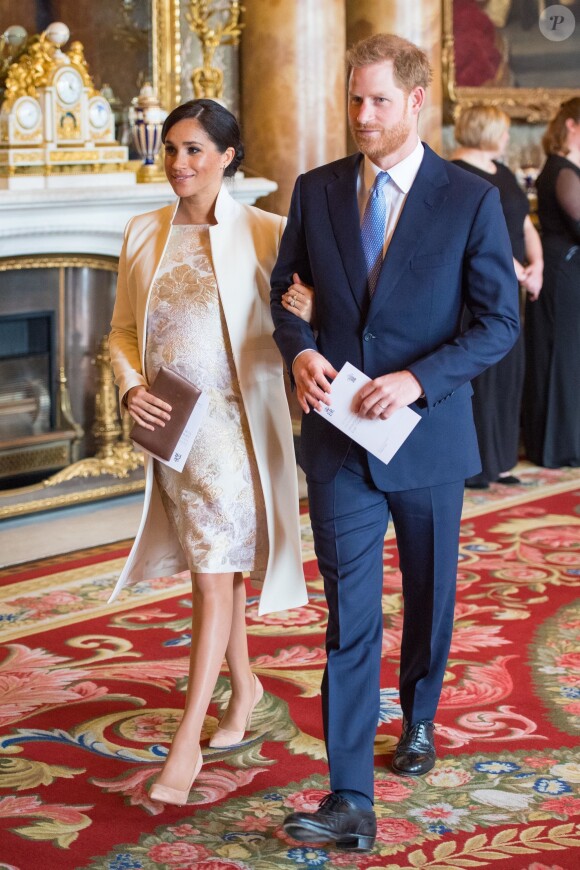 Le prince Harry, duc de Sussex, et Meghan Markle (enceinte), duchesse de Sussex - La famille royale d'Angleterre lors de la réception pour les 50 ans de l'investiture du prince de Galles au palais Buckingham à Londres. Le 5 mars 2019.