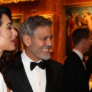 George Clooney et sa femme Amal Clooney avec le prince Charles - Dîner "The Princes Trust" au Buckingham Palace à Londres, le 12 mars 2019.