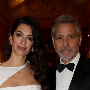 George Clooney et sa femme Amal Clooney avec le prince Charles - Dîner "The Princes Trust" au Buckingham Palace à Londres, le 12 mars 2019.
