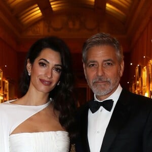 George Clooney et sa femme Amal Clooney avec le prince Charles - Dîner "The Princes Trust" au Buckingham Palace à Londres, le 12 mars 2019.
