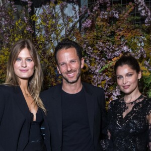 Exclusif - Laurent Milchior (président directeur général d'Etam) entre Constance Jablonski (égérie de la marque de lingerie Etam) et Laetitia Casta lors de la soirée Etam "French Liberté" dans son nouveau flagship, en travaux, boulevard Haussmann dans le quartier de l'Opéra à Paris, France, le 21 mars 2019. Dîner par le chef Cyril Lignac. C'est dans les lieux nus, bruts et minimalistes, bientôt revisités par l'architecte Winy Maas (Agence MVRDV), que la marque a organisé sa French Liberté Party. Le projet a pour ambition de révéler les volumes, les formes, et la matérialité de la magnifique architecture héritée de Haussmann. L'inauguration est prévue courant de l'été 2019. © Rachid Bellak/Cyril Moreau/Bestimage