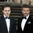 David Beckham et son fils Brooklyn à la première de la série Netflix "Our Planet" au Musée d'Histoires Naturelles à Londres, le 4 avril 2019.