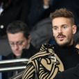 Matt Pokora (M. Pokora) dans les tribunes du parc des Princes lors du match de football de ligue 1, opposant le Paris Saint-Germain (PSG) contre l'Olympique de Marseille (OM) à Paris, France, le 17 mars 2019.