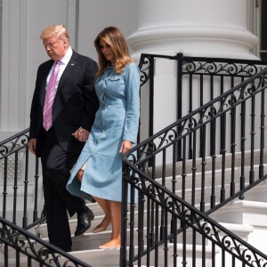 Le président Donald Trump et la première dame Melania Trump lors de la chasse annuelle d'oeuf de Pâques à la Maison Blanche à Washington le 22 avril 2019.