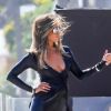 Exclusif - Jennifer Aniston lors d'une une séance photo très sexy avec un Dobermann sur une plage de Malibu, Los Angeles, Californie, Etats-Unis, le 27 mars 2019. Jennifer porte une robe noire moulante, offrant un décolleté plongeant.