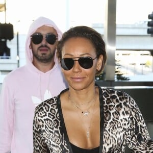 Mel B (Melanie Brown) et Gary Madatyan arrivent à l'aéroport de Los Angeles (LAX), le 7 décembre 2018.