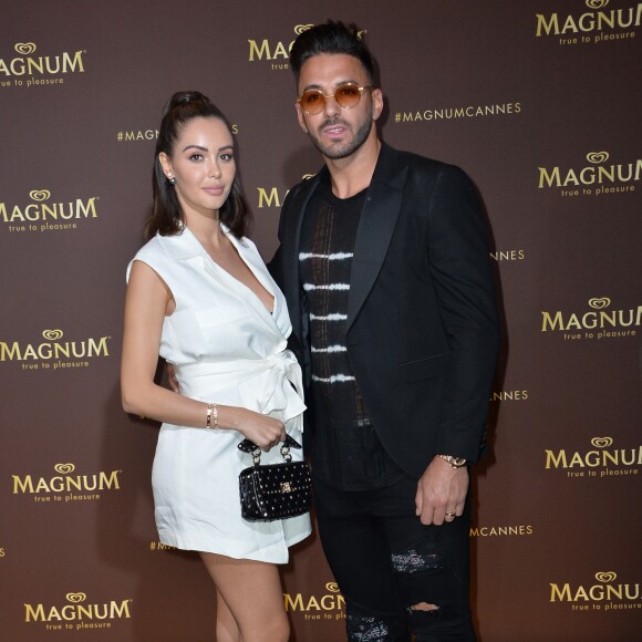 Nabilla Benattia (enceinte) et son mari Thomas Vergara au photocall de l'after party "Magnum x Rita Ora" sur la plage privé Magnum lors du 72ème Festival International du Film de Cannes, France,le 16 mai 2019. © Veeren/Bestimage